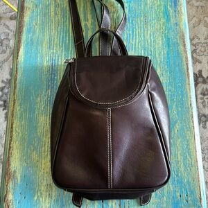 Brown leather backpack by Piel. Silver hardware